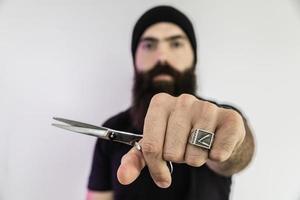 barber with long beard using scissors photo