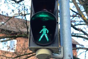 Green and red traffic lights for pedestrians and cars photo