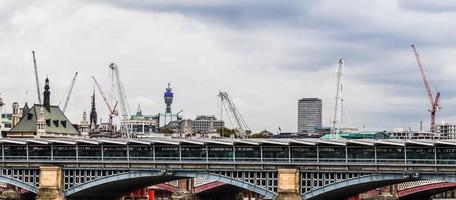 Several cranes on constructions sites at high buildings all over Europe photo