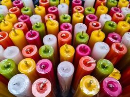 Many colorful torches for sale in a store. photo