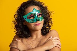 Brazilian Carnival. Young woman in costume enjoying the carnival party. photo