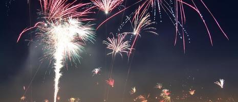 Long time exposure of fireworks over the roofs of vienna photo