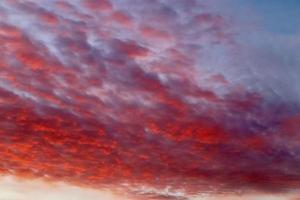 Beautiful panorama of orange and yellow clouds at sunrise photo