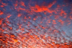 Beautiful panorama of orange and yellow clouds at sunrise photo