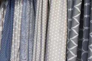 Samples of cloth and fabrics in different colors found at a fabrics market. photo