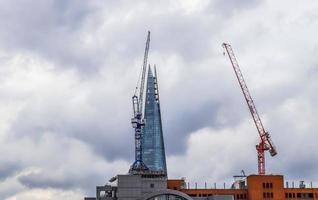 Several cranes on constructions sites at high buildings all over Europe photo