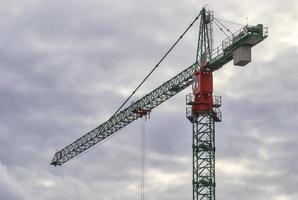 Several cranes on constructions sites at high buildings all over Europe photo