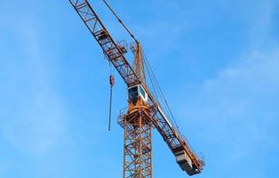 Several cranes on constructions sites at high buildings all over Europe photo