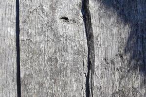 vista de cerca en diferentes superficies de madera de troncos de tablones y paredes de madera en alta resolución foto