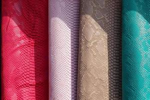Samples of cloth and fabrics in different colors found at a fabrics market. photo