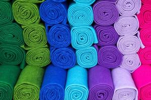 Samples of cloth and fabrics in different colors found at a fabrics market. photo