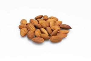 Almonds are placed on the white background at the center of the image,top view,flay lay,top-down.. photo