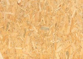 pressed wooden panel background, seamless texture of oriented strand board - OSB wood photo