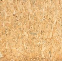pressed wooden panel background, seamless texture of oriented strand board - OSB wood photo