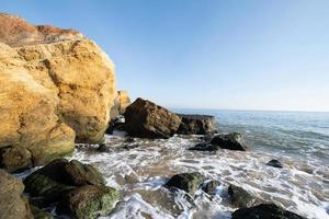 Beautiful landscape with sunset, cliffs and sea photo