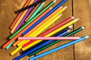 table set with colorful pencils photo