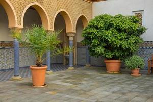 Oriental style park with plants and part of turkish architecture photo