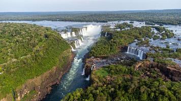 Beautiful aerial view of the Iguassu Falls from a helicopter, one of the Seven Natural Wonders of the World. Foz do Iguacu, Parana, Brazil photo