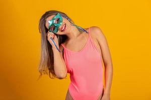 Brazilian Carnival. Young woman in costume enjoying the carnival party. photo