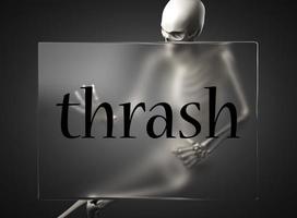 thrash word on glass and skeleton photo