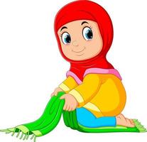 the diligent girl is folding her green prayer rug vector