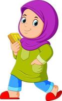 Moslem girl walking and carrying holy Quran vector
