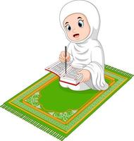 niña musulmana leyendo el sagrado corán