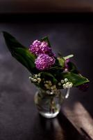 Beautiful lilac flowers branch on a dark background, natural spring background photo