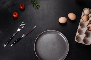A delicious nutritious healthy breakfast with fried eggs, bacon, beans, a glass of juice, oat cookies, milk and jam photo