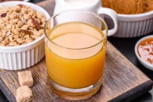 Delicious nutritious healthy breakfast with granola, eggs, oat cookies, milk and jam photo