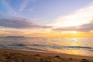 beautiful tropical beach and sea with twilight sky photo