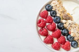 homemade yogurt bowl with raspberry, blueberry and granola