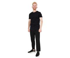 Happy smiling red head young man standing full length isolated on white background copy space. photo