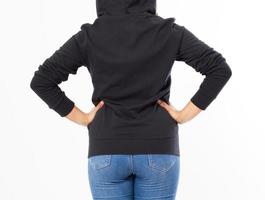 back view - woman in a hoodie on her head isolated on white background cropped image photo