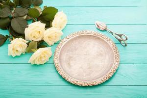 Summer White roses on blue wooden background with copy space. Top view. Mock up. Mother Valentine day. Wedding concept photo