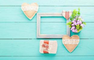 Romantic accessories on blue wooden background with copy space.Top view photo