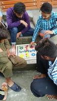 Sialkot, Pakistan, May 2022-Four boys are seen as they play ludo king photo