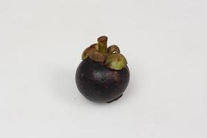 Mangosteen is a tropical fruit from Asia. Mangosteen has a distinctive sweet and sour taste. Mangosteen also has a myriad of benefits, properties, and nutritional content that is useful for health. photo