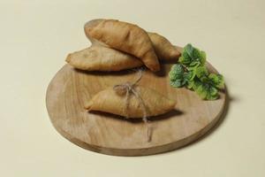 Chocolate bananas from raw materials covered with rolls of pastry dough sheets. Molen bananas with pastries are usually served with a cup of hot coffee or tea. Focus blur photo