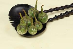 Eggplant is one of the vegetables in the form of fruit. Fruit-producing plants used as vegetables. Green eggplant is round and mini has a different taste from other eggplants. photo