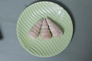 In Indonesia, this cake is known as cumcum cake. A cake shaped like a trumpet, or an ice cream cone. The perfect combination of a dry cake studded with sugar, plus a delicious cream vanilla filling. photo