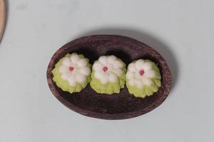 Putu Ayu as a snack in your spare time. Putu Ayu has a soft and tender texture. This putu cake has a very delicious and soft taste when eaten. Indonesian food. Has a pandan scent. Focus blur. photo