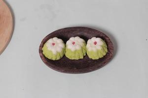 Putu Ayu as a snack in your spare time. Putu Ayu has a soft and tender texture. This putu cake has a very delicious and soft taste when eaten. Indonesian food. Has a pandan scent. Focus blur. photo