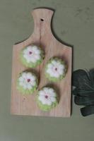 Putu Ayu as a snack in your spare time. Putu Ayu has a soft and tender texture. This putu cake has a very delicious and soft taste when eaten. Indonesian food. Has a pandan scent. Focus blur. photo