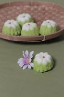 Putu Ayu as a snack in your spare time. Putu Ayu has a soft and tender texture. This putu cake has a very delicious and soft taste when eaten. Indonesian food. Has a pandan scent. Focus blur. photo