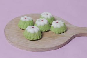 Putu Ayu as a snack in your spare time. Putu Ayu has a soft and tender texture. This putu cake has a very delicious and soft taste when eaten. Indonesian food. Has a pandan scent. Focus blur. photo