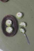 Putu Ayu as a snack in your spare time. Putu Ayu has a soft and tender texture. This putu cake has a very delicious and soft taste when eaten. Indonesian food. Has a pandan scent. Focus blur. photo