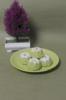 Putu Ayu as a snack in your spare time. Putu Ayu has a soft and tender texture. This putu cake has a very delicious and soft taste when eaten. Indonesian food. Has a pandan scent. Focus blur. photo