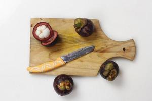 Mangosteen is a tropical fruit from Asia. Mangosteen has a distinctive sweet and sour taste. Mangosteen also has a myriad of benefits, properties, and nutritional content that is useful for health. photo