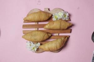 Chocolate bananas from raw materials covered with rolls of pastry dough sheets. Molen bananas with pastries are usually served with a cup of hot coffee or tea. Focus blur photo